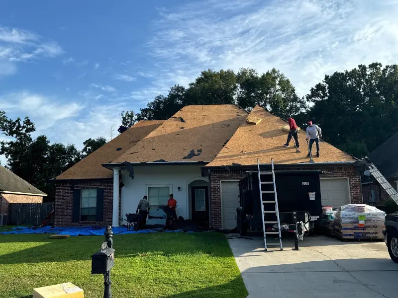roofing crew replacing shingles in zachary louisiana