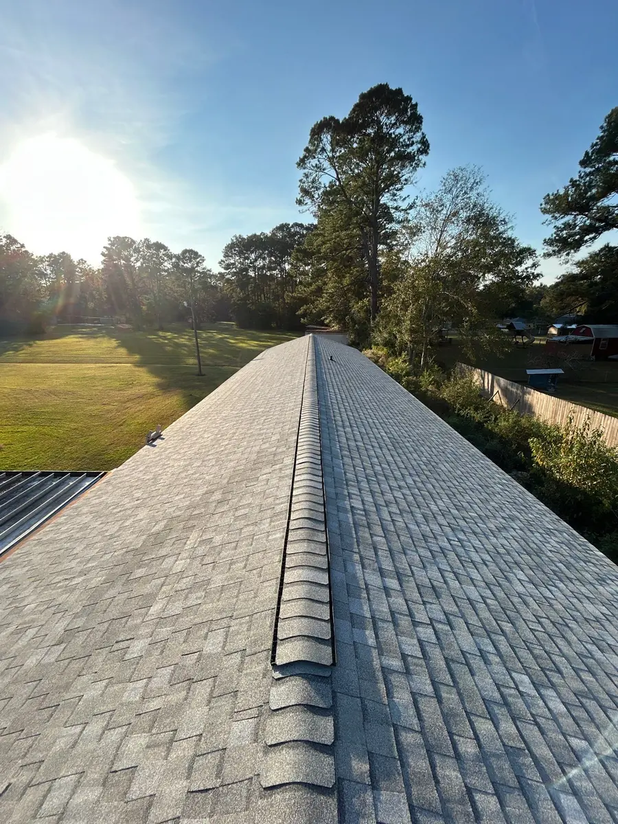 Finished architectural shingle roof and clean ridge line on a Greenwell Springs church