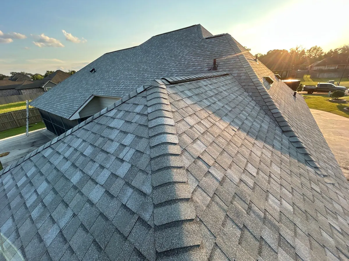 Finished hip roof in CertainTeed Landmark shingles at sunset in Central, Louisiana
