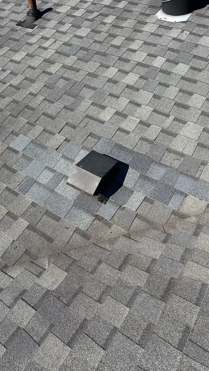 Box vent set in new shingles woven into the existing roof with no surface tar after a roof repair in Greenwell Springs, LA