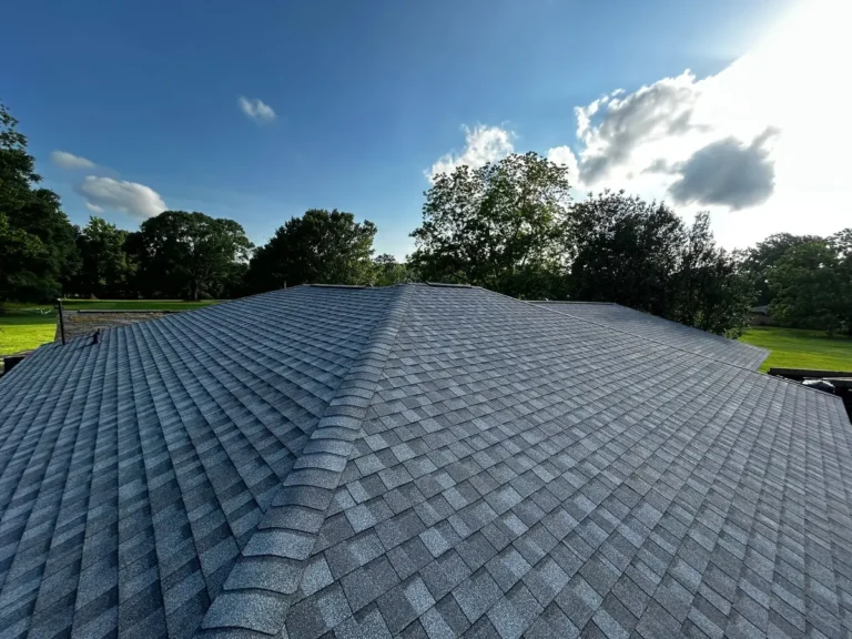 Finished roof in new architectural shingles under a clear sky after the one-day install in Slaughter, Louisiana