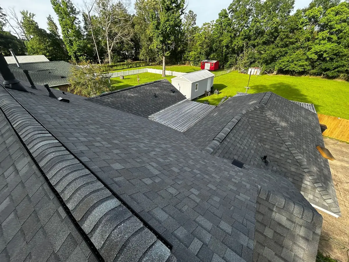 Finished architectural shingle roof with vented ridge cap and hips on a Greenwell Springs, LA home by Roof Rescue