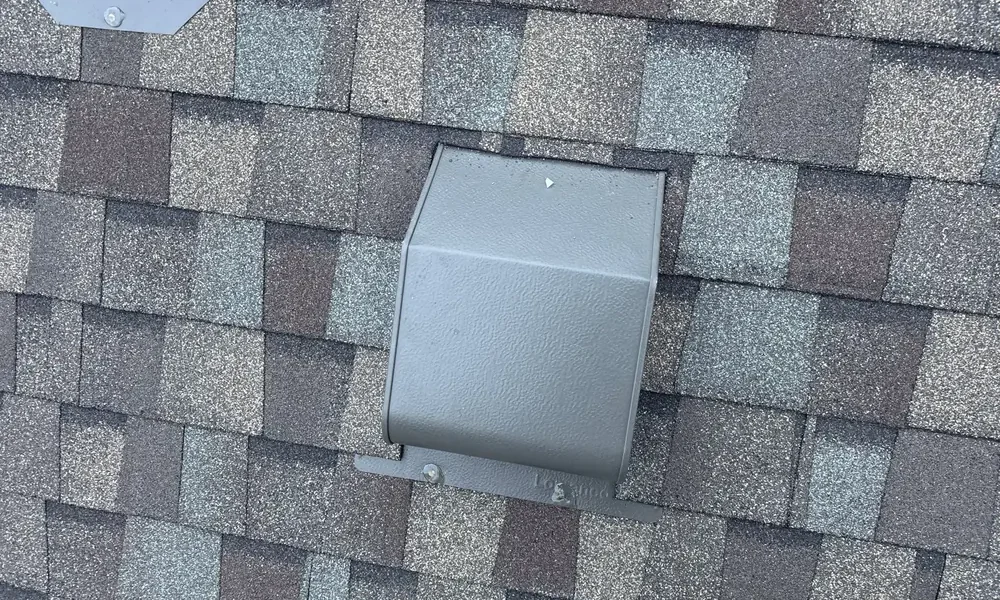 Box vent set into new architectural shingles in Central, Louisiana
