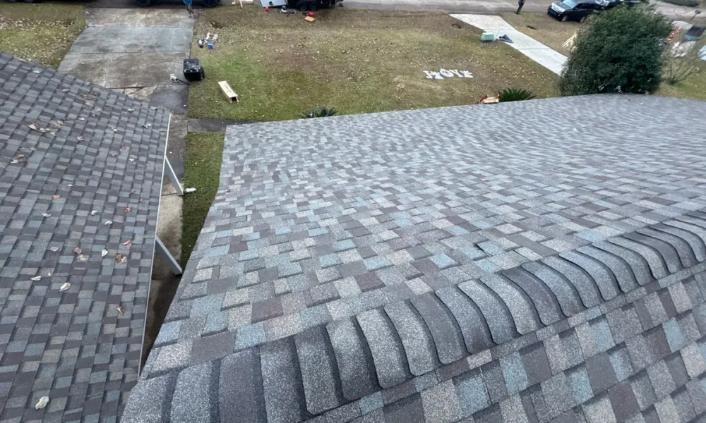 Hip ridge cap on a new architectural shingle roof in Central, Louisiana