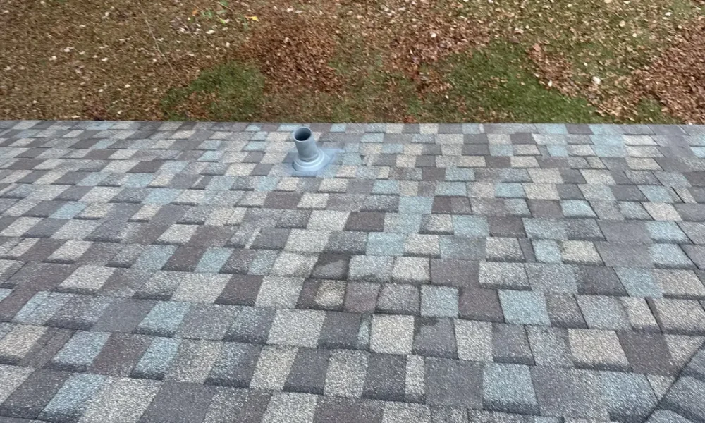 Pipe vent on a new architectural shingle field in Central, Louisiana