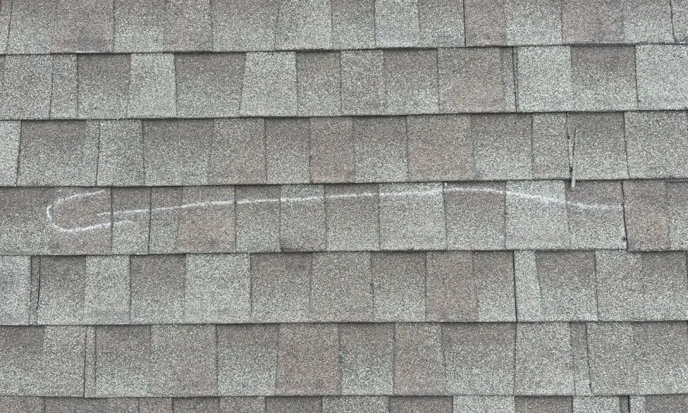 Hip roof with new architectural shingles and chimney flashing in Zachary, Louisiana