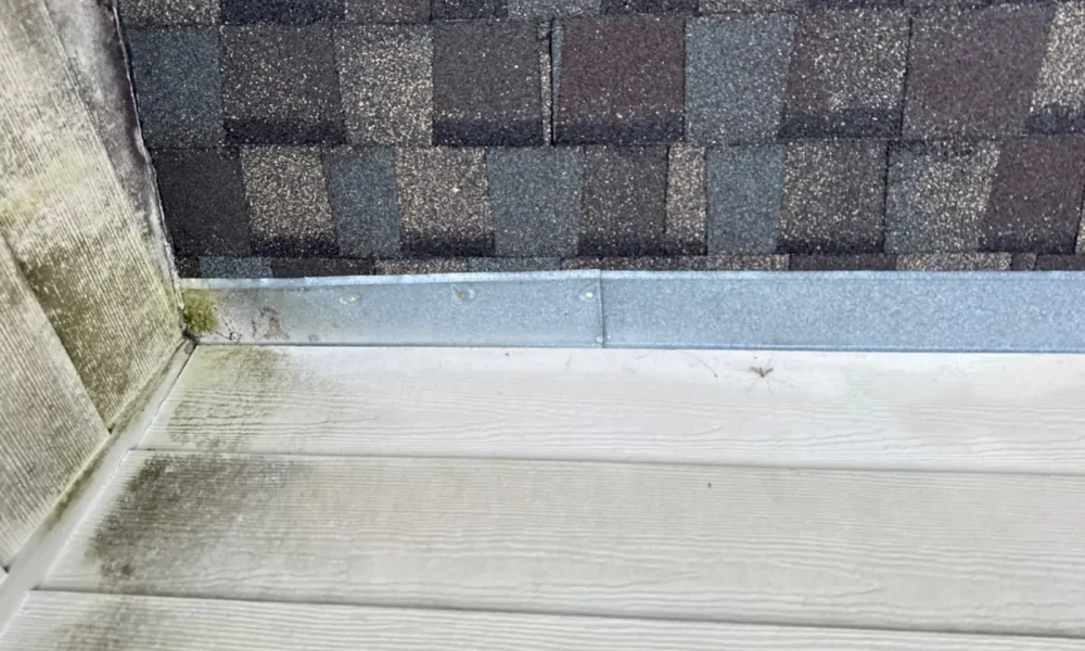 Shingle courses and wall flashing detail on a Zachary, Louisiana roof
