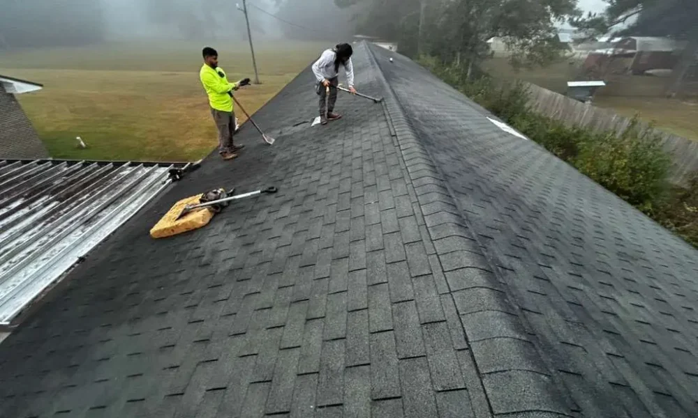 Roof Rescue crew tearing off the old shingle roof on a church building in Greenwell Springs, Louisiana