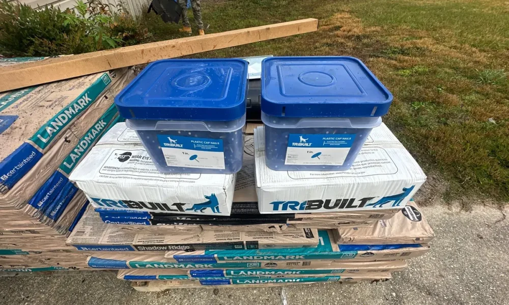 CertainTeed Landmark shingle bundles and TRI-BUILT synthetic underlayment staged on site in Greenwell Springs