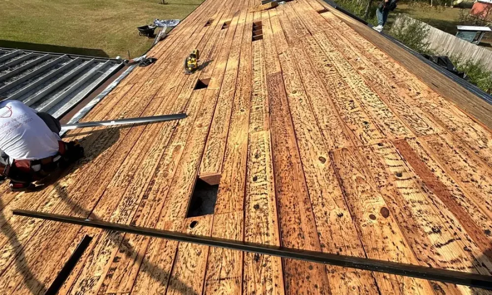 Bare roof decking exposed after full tear-off on a Greenwell Springs church roof replacement