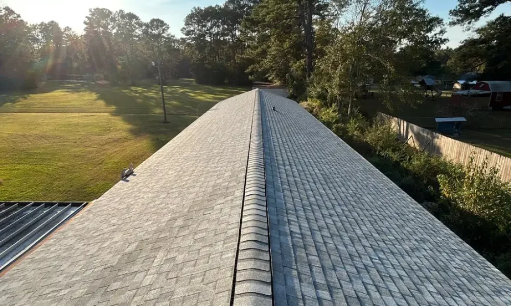 Finished architectural shingle roof and clean ridge line on a Greenwell Springs church