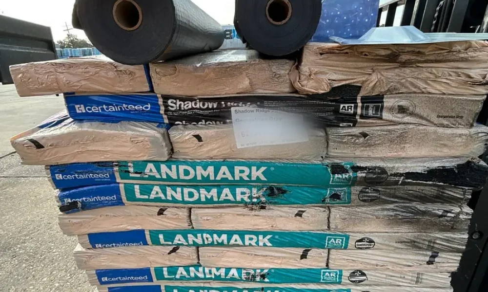 CertainTeed Landmark shingle bundles, Shadow Ridge hip and ridge cap and synthetic underlayment rolls on a pallet