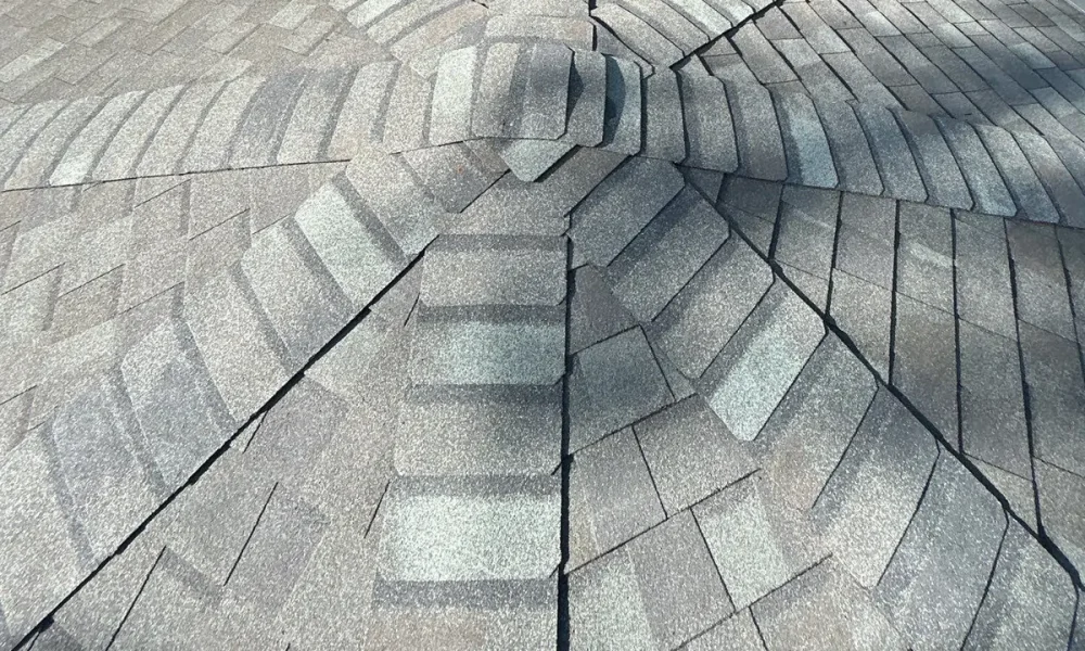 Finished CertainTeed Landmark roof where eight hips meet at the peak