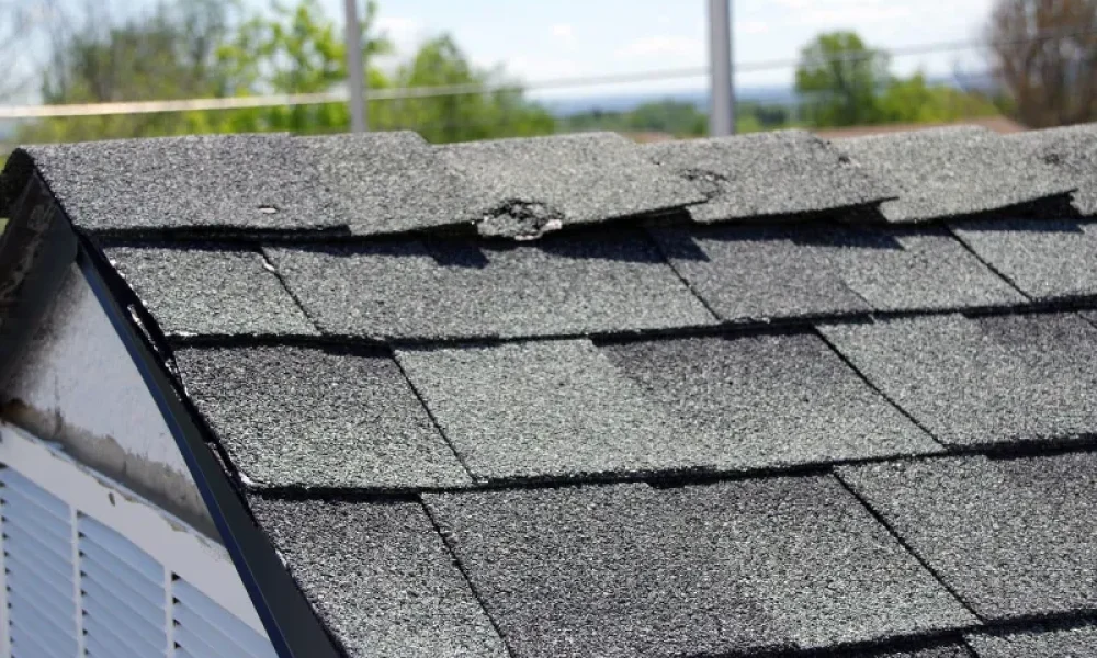 hail messed up the ridge cap on this roof
