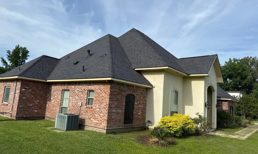 Rear elevation of a Zachary, Louisiana home showing the finished architectural shingle roof and new ridge vent