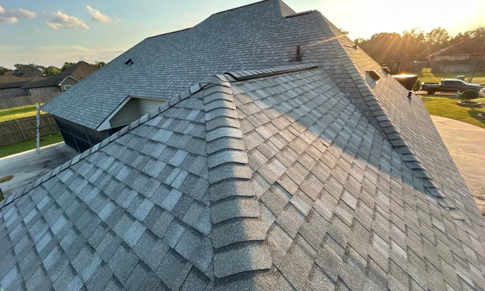 Finished hip roof in CertainTeed Landmark shingles at sunset in Central, Louisiana