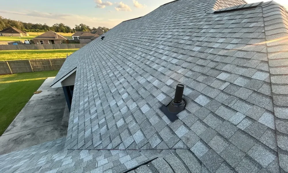 Finished CertainTeed Landmark shingle field with a flashed pipe penetration on a Central, Louisiana hip roof