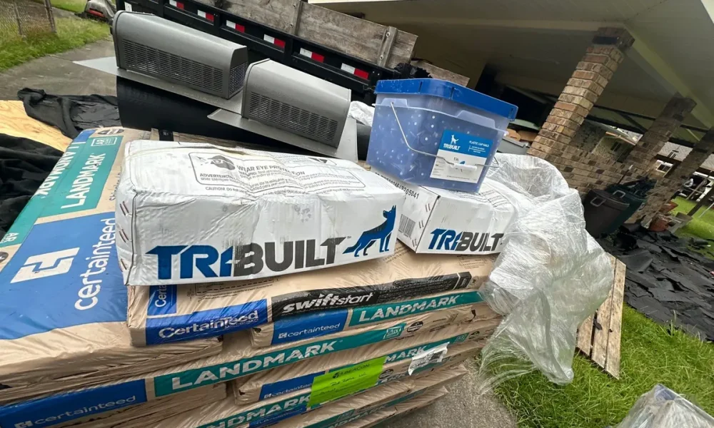 CertainTeed Landmark shingle bundles, TriBuilt underlayment and two new box vents staged for a Baker, LA roof replacement