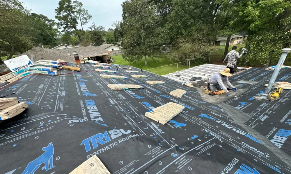 Roof Rescue crew laying CertainTeed Landmark shingles over TriBuilt synthetic underlayment on a Baker, Louisiana roof