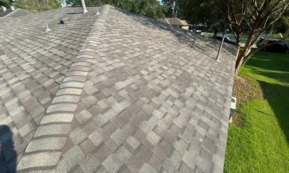 New Landmark shingles, hip cap and pipe flashing on the finished roof of a Baker, LA home