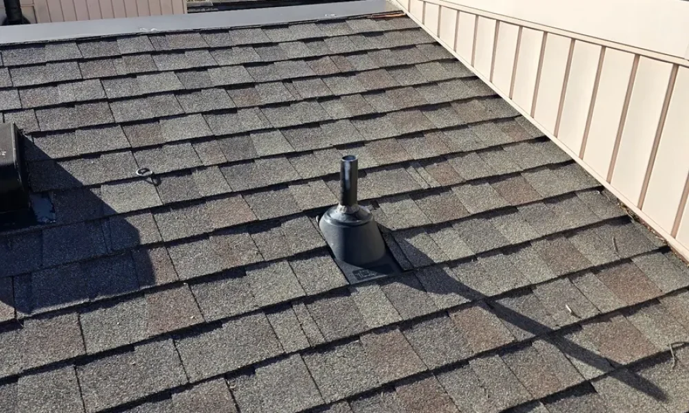 Replaced pipe flashing on an upper roof section of a Baker home