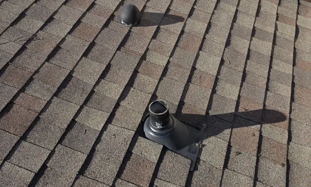 New pipe flashings on a Baker roof right after the repair