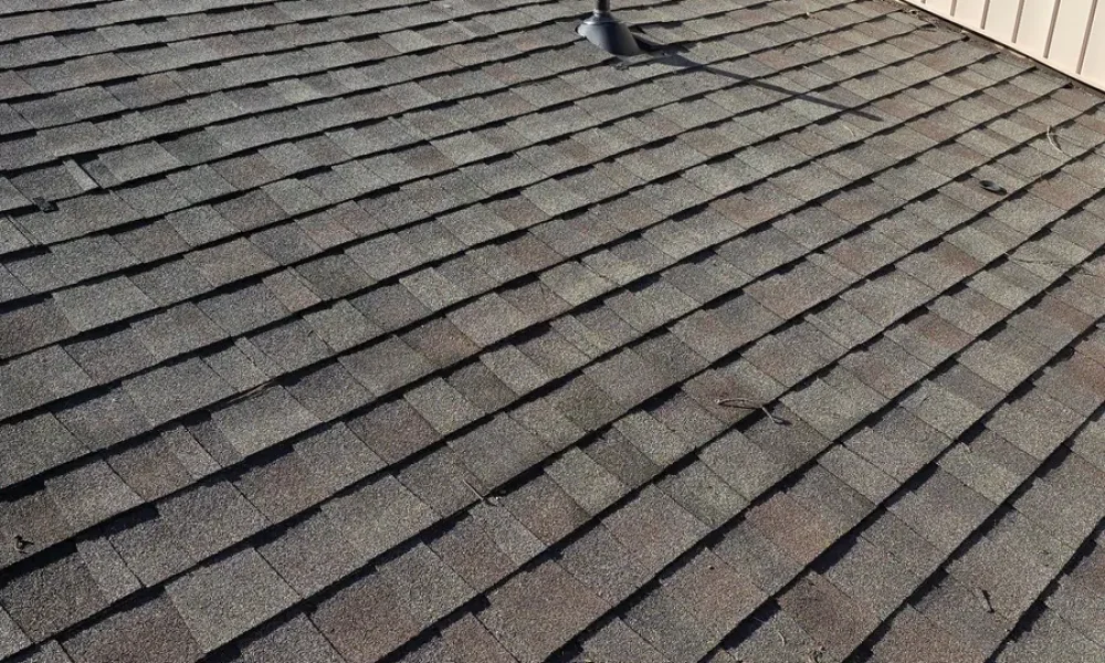 Finished roof with new pipe flashings in place after the repair in Baker, LA