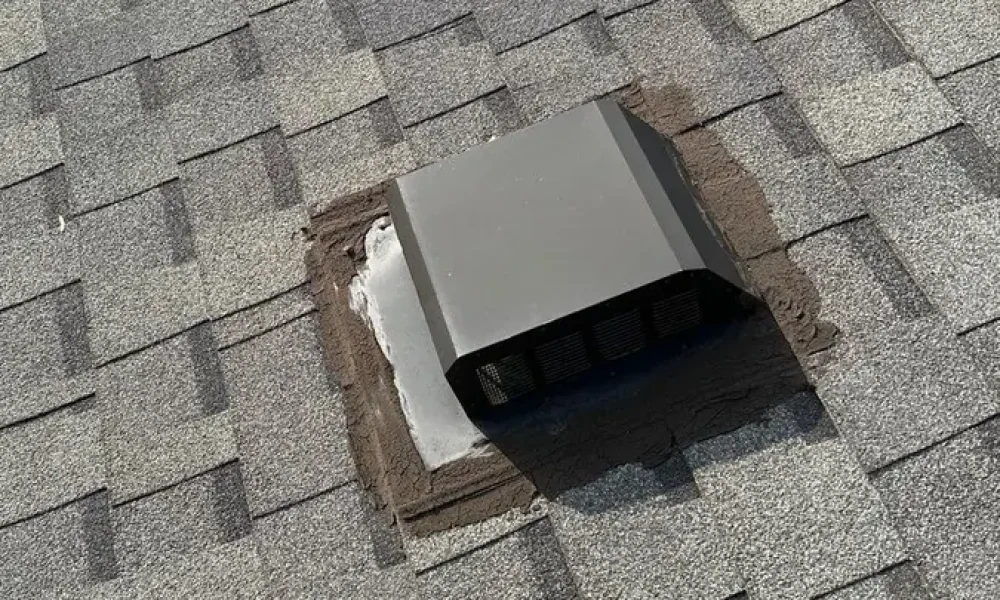 Roof exhaust vent with sealant around its flashing on a Greenwell Springs, LA shingle roof, photographed at inspection
