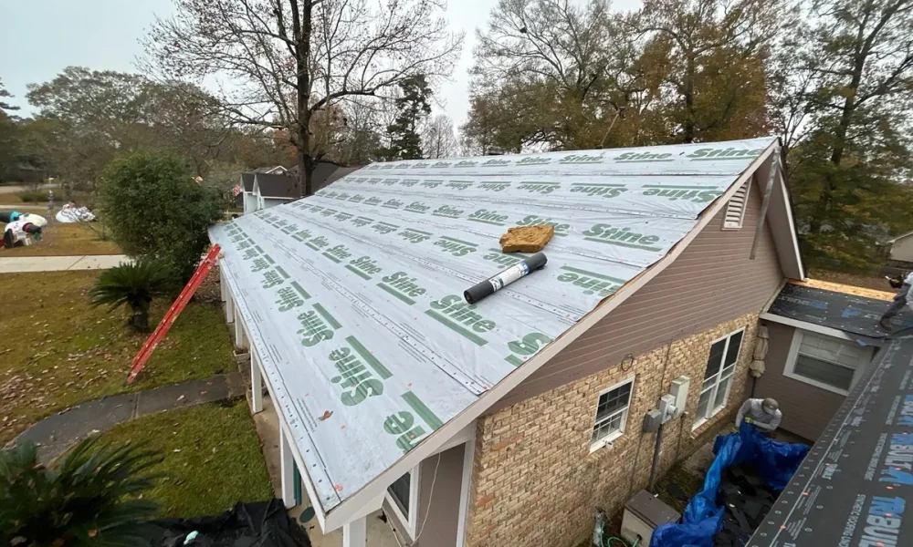 Synthetic underlayment going down over the decking on a Central, Louisiana home