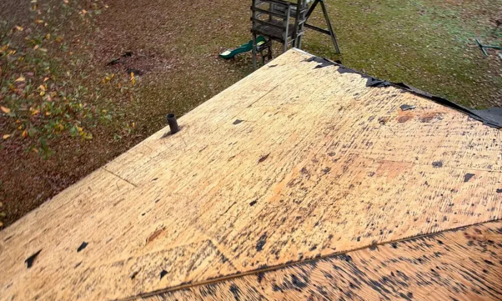 Roof deck inspected board by board before new underlayment and shingles are installed