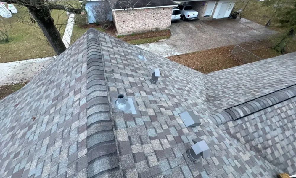 Completed roof replacement with new vents and clean shingle courses in Central, Louisiana