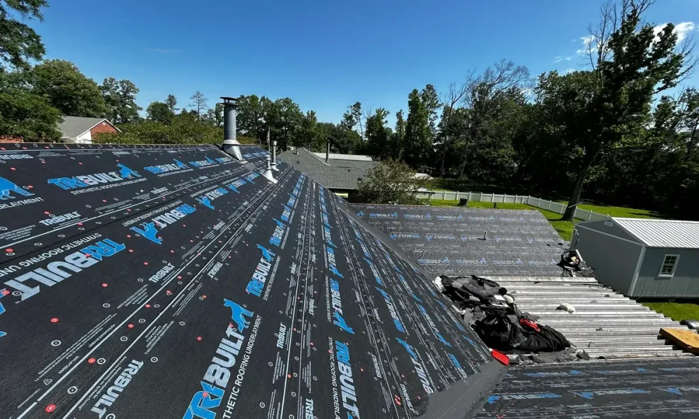 TriBuilt synthetic roofing underlayment covering the deck up to the ridge during a Greenwell Springs, LA roof replacement