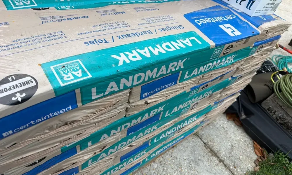Pallets of CertainTeed Landmark architectural shingles delivered for the Saint Gabriel roof replacement