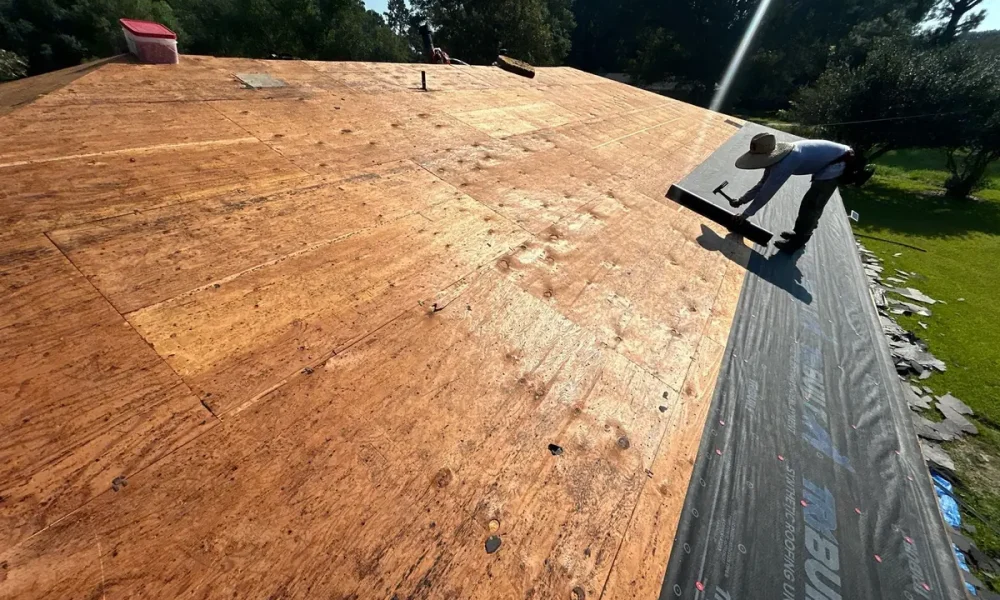 Roof stripped to bare plywood decking during the Slaughter, Louisiana tear-off