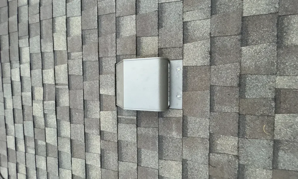 Close detail of architectural shingle courses and a roof vent on a Zachary, Louisiana roof replacement