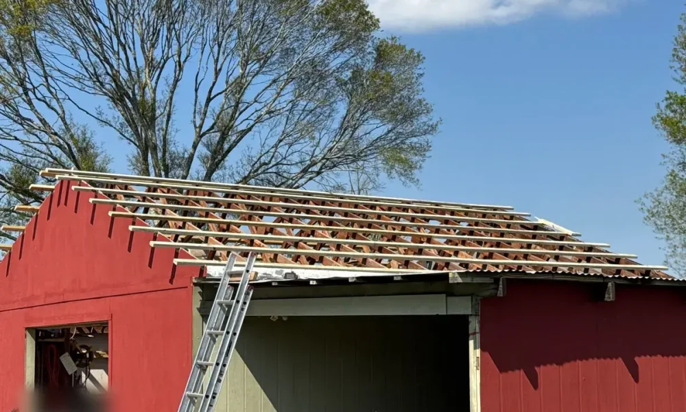 New 2x4 lats fastened across the rafters of a Zachary, LA shop roof